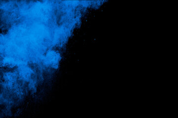 Wall Mural - Bizarre forms of blue powder explosion cloud on white background.Launched blue dust particles splashing.