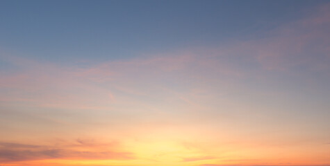 Wall Mural - beautiful vivid sky painted by the sun leaving bright golden shades.dense clouds in twilight sky in 