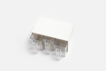 Plastic drawer with pull-out containers isolated on white background. High-resolution photo.