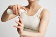 © SHOTPRIME STUDIO - woman in white tank top skin lotion health rejuvenation