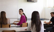 © liderina - Teenagers students sitting in the classroom working exam.