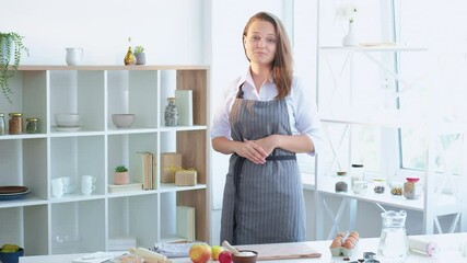 Sticker - Online culinary school. Gingerbread cookies recipe. Virtual blog. Happy chef woman describing ingredients and process of cooking Christmas pastry looking photo camera light home kitchen interior.