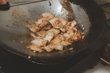 Wall Mural - Cooking fried pork belly with garlic and pepper.