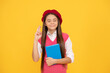 © Olena - dreamy teen school girl in french beret hold copybook on yellow background, make a wish