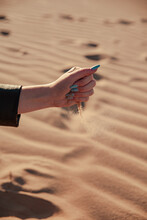 Young Girl Hands Playing With Some Sand