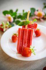 Poster - homemade strawberry ice cream on a stick made from fresh strawberries in a plate