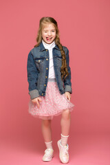 cheerful little girl shows tongue, happy childhood concept