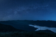 Scenic View Of Mountains Against Sky At Night