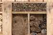 Insect hotel made of natural material like wood, branches, dried grass, bamboo sticks and pine cones for a better biodiversity