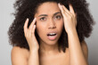 © fizkes - Close up portrait of unhappy African American young woman worry about wrinkles on face, think of botox treatment. Anxious mixed race female shocked by pimple blackhead. Skincare concept.