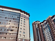 Modern Apartment Buildings On A Sunny Day With A Blue Sky. Facade Of A Modern Apartment Building. Residential Building Modern Apartment Condominium Architecture