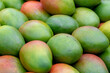 © Sarawut - Staked of fresh ripe fruit on the market stall, A mango is an edible stone fruit produced by the tropical tree Mangifera indica, Worldwide there are several hundred cultivars of mango.