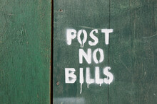Post No Bills On Green Wooden Fence