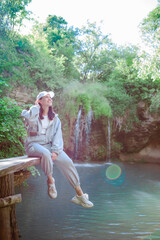 Poster - woman hiker enjoying view of waterfall