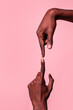 © ADDICTIVE STOCK - Opposed hands of black man pointing at each other
