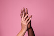 © ADDICTIVE STOCK - Hands of white woman and black man touching