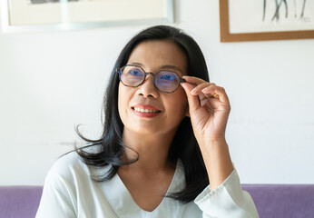 Smiling Woman Wearing Glasses with Black Long Hair.  Middle Age Lady Positive Thinking in Her Life Style.
