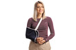 Young woman with a broken arm wearing an arm splint smiling at camera