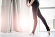 © tan4ikk - Ballerina legs in dance studio