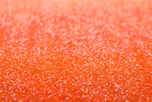 Shiny Orange Glitter As Background. Bokeh Effect