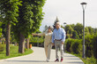 © Studio Romantic - Active senior old couple walking in park talking enjoy time together. Older caucasian family staying in love spend day together. Elder healthy leisure lifestyle concept. Happy retirement and pleasure
