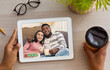 © Prostock-studio - Top view of black lady videoconferencing with multiracial young couple on tablet pc at table