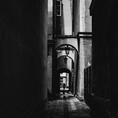 Wall Mural - silhouette in the alley, street photography, monochrome, Warsaw, Poland