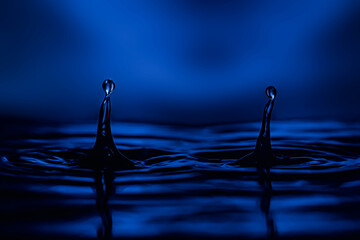 two drops on the water create shapes