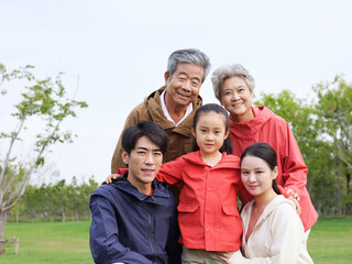 Happy family of five in the park