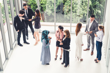 Wall Mural - Many business people gathering in modern office building for business conference in the city. Businessmen and businesswomen communication and human resources concept.