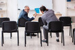 © Elnur - Two businessmen in the classroom in pandemic concept