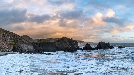 Wall Mural - stunning landscape image of view from hartland quay in devon england durinbg moody spring sunset