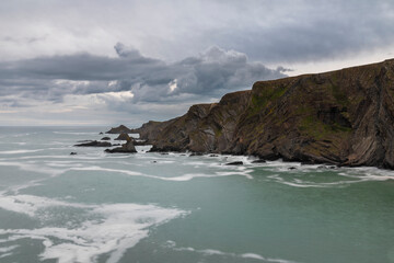 Wall Mural - stunning fine art landscape image of view from hartland quay in devon england durinbg moody spring s