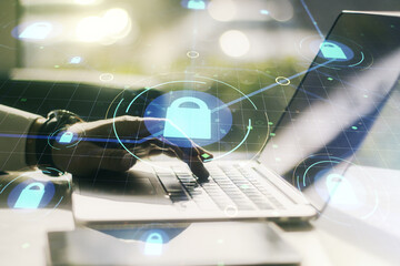 Aufkleber - Double exposure of creative lock hologram with chip and hands typing on laptop on background. Information security concept