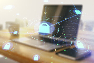 Poster - Double exposure of creative lock hologram with chip and modern desktop with laptop on background. Information security concept