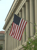 Fototapeta  - Washington, DC, USA - April 25, 2004: Flag displayed outside of the United States Department of Commerce Building