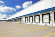 © Brian - Exterior of warehouse industrial building with semi truck loading dock