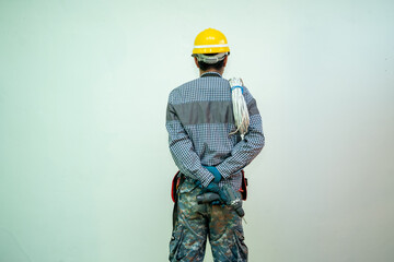 Aufkleber - Electrician with a safety helmet and bunch of wires indoors.