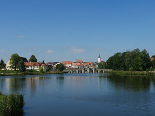 Sticker - Beautifiul view of the river surrounded by houses and fields on a sunny day