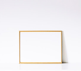 Golden frame on white furniture, luxury home decor and design for mockup, poster print and printable art, online shop showcase.