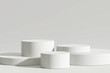 © nawapon - Podium product display stand on white background. 3D rendering