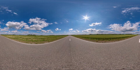 Wall Mural - full seamless spherical hdri panorama 360 degrees angle view on no traffic asphalt road among field in sunny day and blue sky with clouds in equirectangular projection, ready for VR AR virtual reality