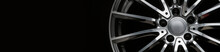 An Alloy Wheel Banner Fragment On A Black Background. Mockup For The Panorama Site Header. Car Tuning Auto Parts. Background