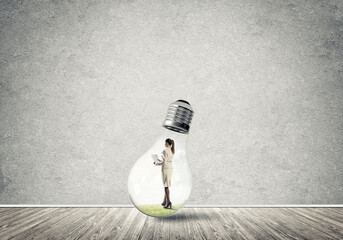 Businesswoman trapped in bulb