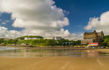 Low Tide In The South Bay, Scarborough, North Yorkshire. The Photo Looks Across The Sands Towards The Spa Complex, Spa Bridge And Grand Hotel.