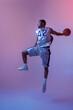© Nomad_Soul - Basketball player jumping with ball in studio