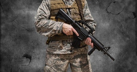 Poster - Composition of midsection of soldier holding gun, against smoke on dark background