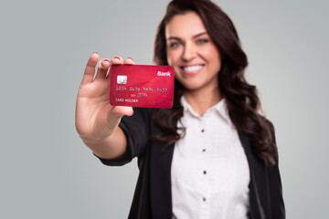 Friendly woman showing credit card