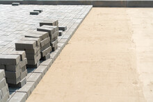 New paving slabs in rows in summer close-up. Laying of paving slabs, copy space