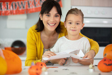 family mother and child daughter preparing halloween